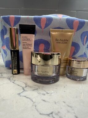 Estee Lauder Skincare Set in Purple and Gold with Pink Primer